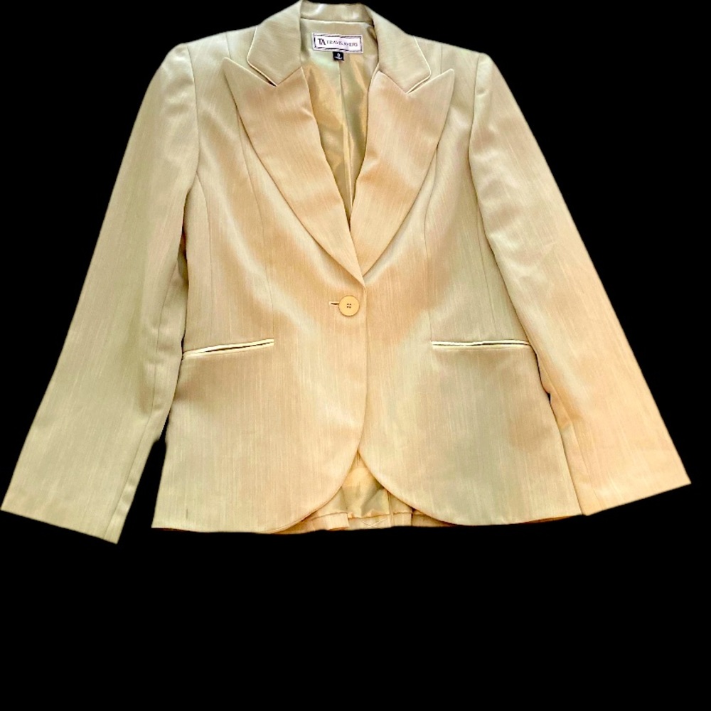 Travis Ayer’s sage green blazer and pants